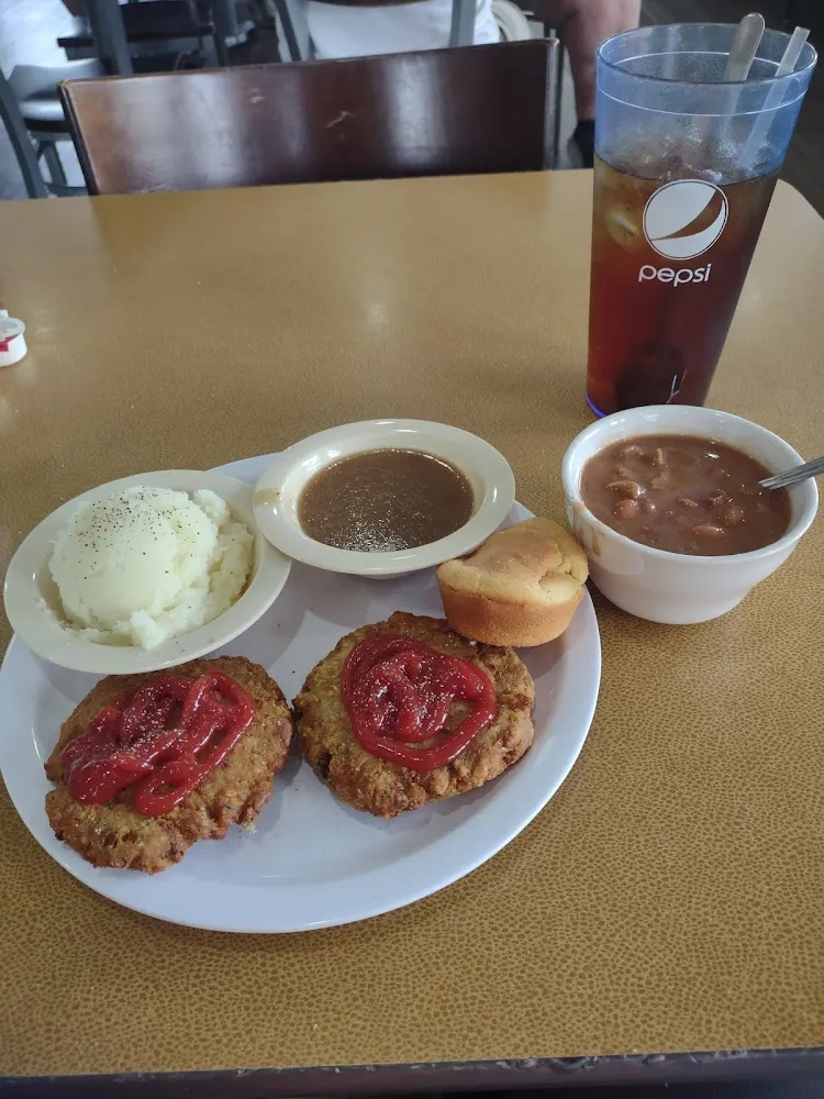 Salmon Patties Mashed Potatoes and Gravy with Pinto Beans